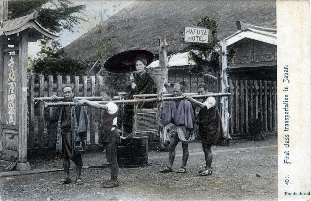 Woman in palanquin in front of Hafuya Shirozaemon hotel on the shores of Lake Ashino, c. 1900.